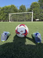 Strykr Flight Pro size 5 soccer ball on turf with soccer cleats